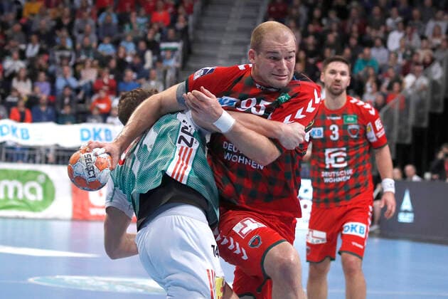 08 12 2019, TUI Arena, Hannover, league match, 1 Bundesliga, TSV Hannover Burgdorf vs Fuechse Berlin, in picture Vincent Buechner 74, Han Burgdorf in duel with Paul Drux 95, Berlin TSV Hannover Burgdorf vs Fuechse Berlin