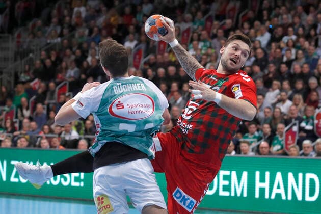 08 12 2019, TUI Arena, Hannover, league match, 1 Bundesliga, TSV Hannover Burgdorf vs Fuechse Berlin, in picture Vincent Buechner 74, Han Burgdorf in duel with Johan Koch 77, Berlin TSV Hannover Burgdorf vs Fuechse Berlin