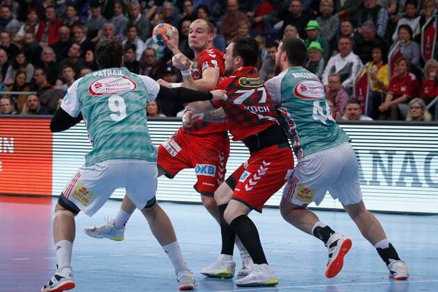 08 12 2019, TUI Arena, Hannover, league game, 1 Bundesliga, TSV Hannover Burgdorf vs Fuechse Berlin, in the picture Mait Patrail 9, Han Burgdorf and Ilija Brozovic 44, Han Burgdorf in the duel with Paul Drux 95, Berlin and Johan Koch 77, Berlin TSV Hannover Burgdorf vs Fuechse Berlin