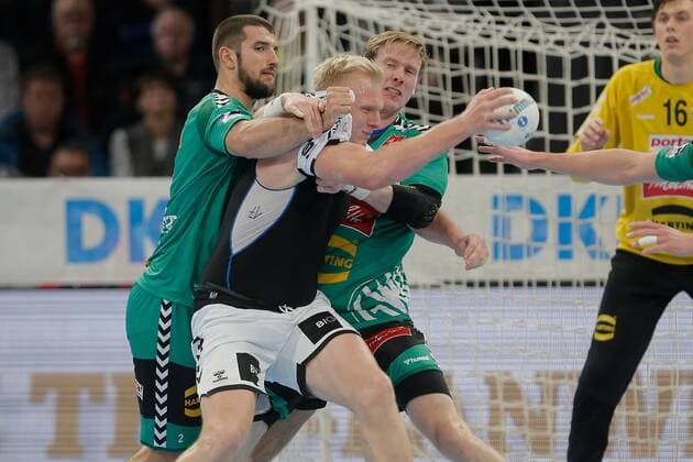 1 Handball Bundesliga THW Kiel TSV GWD Minden, Kiel, 8 12 2019 Patrick Wiencek Kiel, 17 in duel against Lucas Meister Minden, 2 and Magnus Gullerud Minden, 21 Copyright: xBEAUTIFULxSPORTS DRPx