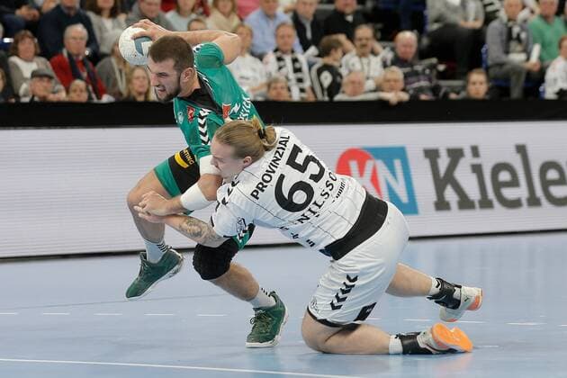 1 Handball Bundesliga THW Kiel TSV GWD Minden, Kiel, 8 12 2019 Lucas Meister Minden, 2 in duel against Lukas Nilsson Kiel, 65 Copyright: xBEAUTIFULxSPORTS DRPx