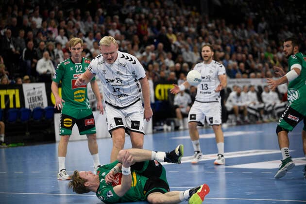 Magnus Gullerud GWD, 21 on the ground and Patrick Wiencek THW Kiel, 17 , Handball Bundesliga, Liqui Moly HBL, Men, 16 Matchday, THW Kiel vs. GWD Minden, 08 12 19 Kiel Sparkassen Arena Schleswig Holstein Germany