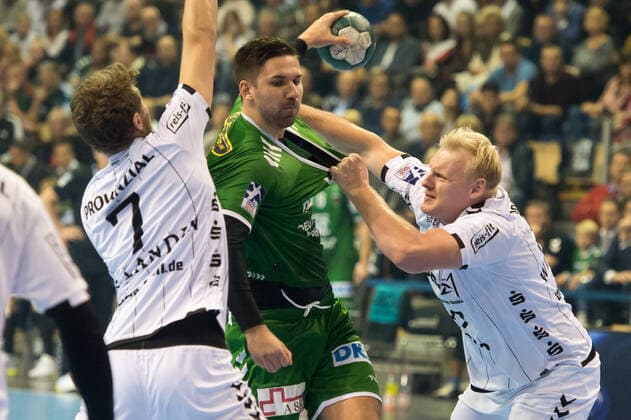 Fabian Wiede GER 3 Foxes Berlin tries against Patrick Wincek GER 17 THW Kiel action game scene landscape horizontal event event foxes Berlin vs. THW Kiel HBL Handball Bundesliga 2019 20 17 game day location place Max Schmeling Halle Berlin Germany Germany Europe Date Date 12 12 2019 Stiehl Photography