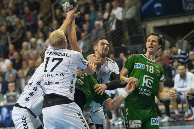 Paul Drux GER 95 Foxes Berlin tries to play against three Kiel players action game scene landscape horizontal event event foxes Berlin vs. THW Kiel HBL Handball Bundesliga 2019 20 17 game day location place Max Schmeling Halle Berlin Germany Europe Date Date 12 12 2019 Stiehl Photography