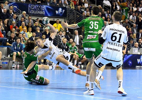 12 12 2019, xlakx, Handball Bundesliga, Fuechse Berlin THW Kiel emspor, v l Jacob Tandrup Holm Fuechse Berlin 6, on the ball to the throw Harald Reinkind THW Kiel 6, Marko Kopljar Fuechse Berlin 35, Hendrik Pekeler THW Kiel 61 Berlin