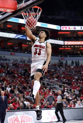 Louisville Cardinals Jordan Nwora (33) dunks the basketball over Eastern Kentuckys defense during the first half of play at the KFC Yum! Center in Louisville, Kentucky, Saturday, December 14, 2019.  JPS20191214003 JohnxSommersxII