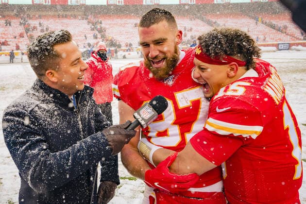 Kansas City Chiefs quarterback Patrick Mahomes (15) embraces tight end Travis Kelce (87) during an interview after defeating the Denver Broncos at Arrowhead Stadium in Kansas City, Missouri on Sunday, December 15, 2019.  KCP20191215127 KYLExRIVAS