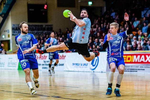 vlr Vincent Sohmann 10 Dessau Rosslauer HV 06 , Nikolaos Tzoufras 23 Eintracht Hildesheim , Slavomir Mlotek 20 Dessau Rosslauer HV 06 during the match in the 3 League North East Men Handball Season 2019 2020 between Dessau Rosslauer HV 06 and Eintracht Hildesheim in the Anhalt Arena on 22 December 2019 in Dessau Rosslau, Saxony Anhalt, Germany