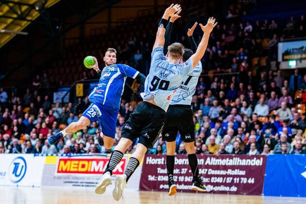 Daniel Zele 28 Dessau Rosslauer HV 06 , Matteo Ehrlers 99 Eintracht Hildesheim during the match in the 3 League North East Men Handball Season 2019 2020 between Dessau Rosslauer HV 06 and Eintracht Hildesheim in the Anhalt Arena on 22 December 2019 in Dessau Rosslau, Saxony Anhalt, Germany