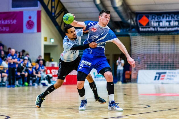 Timo Löser 5 Dessau Rosslauer HV 06 on ball Maurice Lungela 17 Eintracht Hildesheim during the match in the 3 League North East Men Handball Season 2019 2020 between Dessau Rosslauer HV 06 and Eintracht Hildesheim in the Anhalt Arena on 22 December 2019 in Dessau Rosslau, Saxony Anhalt, Germany