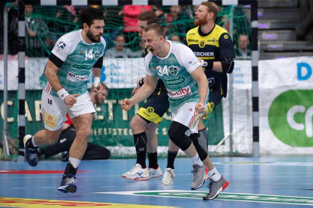 26 12 2019, TUI Arena, Hanover, league match, 1 Bundesliga, TSV Hanover Burgdorf vs TVB Stuttgart, in picture Evgeni Pevnov 14, Han Burgdorf and Morten Olsen 34, Han Burgdorf cheering TSV Hanover Burgdorf vs TVB Stuttgart