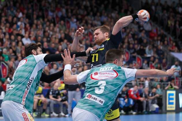 26 12 2019, TUI Arena, Hanover, league match, 1 Bundesliga, TSV Hanover Burgdorf vs TVB Stuttgart, pictured Mait Patrail 9, Han Burgdorf and Nejc Cehte 3, Han Burgdorf in duel with David Schmidt 77, Stuttgart TSV Hanover Burgdorf vs TVB Stuttgart