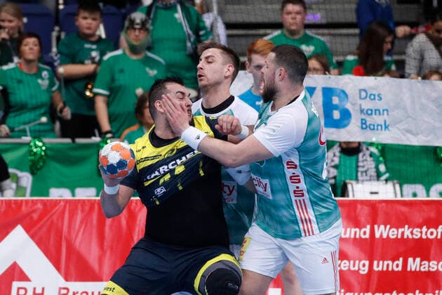 26 12 2019, TUI Arena, Hanover, league match, 1 Bundesliga, TSV Hanover Burgdorf vs TVB Stuttgart, pictured Zarko Peshevski 44, Stuttgart in duel with Nejc Cehte 3, Han Burgdorf and Ilija Brozovic 44, Han Burgdorf TSV Hanover Burgdorf vs TVB Stuttgart