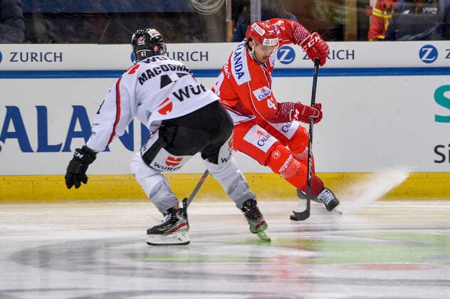 26 12 2019, Davos, Vaillant Arena, Spengler Cup HC Trinec Team Canada, Matej Stransky Ocelari Trinec against Andrew MacDonald Team Canada Davos Vaillant Arena Grisons Switzerland Copyright: xJustPictures.ch AndreaxBrancax