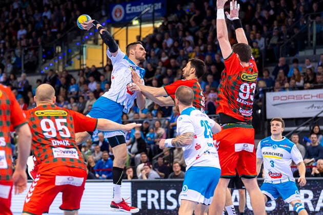 Stuttgart, Germany 29 December 2019 HBL 19 20 TVB 1898 Stuttgart vs. Füchse Berlin Dominik Weiss Stuttgart in the throw against Marko Kopljar Berlin , Patrick Zieker Stuttgart , Mijajlo Marsenic Berlin Stuttgart Porsche Arena Baden Württemberg Germany