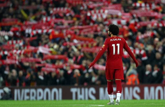 29th December 2019; Anfield, Liverpool, Merseyside, England; English Premier League Football, Liverpool versus Wolverhampton Wanderers; Mohammed Salah of Liverpool in front of Liverpool fans with their scarves raised as they sing "You ll Never Walk Alone" prior to the kick off - Strictly Editorial Use Only. No use with unauthorized audio, video, data, fixture lists, club league logos or live services. Online in-match use limited to 120 images, no video emulation. No use in betting, games or single club league player publications ActionPlus12199331 DavidxBlunsden