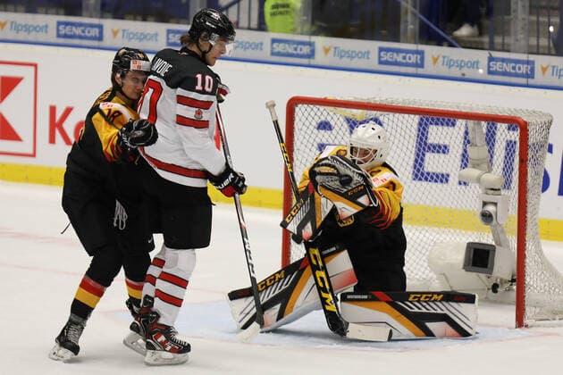 L-R Taro Jentzsch (GER), Raphael Lavoi (CAN) and Hendrik Hane (GER) in action during the 2020 IIHF World Junior Ice hockey, Eishockey Championships Group B match between Germany and Canada in Ostrava, Czech Republic, on December 30, 2019. (CTKxPhoto PetrxSznapka) CTKPhotoP201912300464001  SZN 02