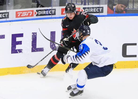 OSTRAVA, CZECH REPUBLIC - JANUARY 4, 2020: Canada s Aidan Dudas (L) and Finland s Aatu Raty in their 2020 World Junior Ice hockey, Eishockey Championship semifinal match at Ostravar Arena. Peter Kovalev TASS  TS0C96DA
