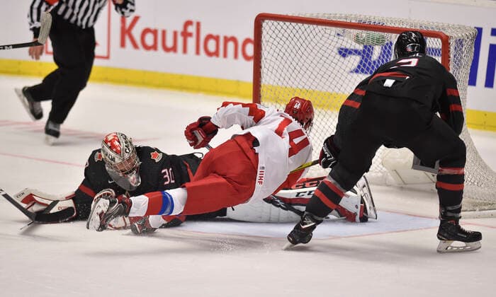 (L-R) Canadian goalkeeper Joel Hofer, Grigori Denisenko of Russia and Kevin Bahl of Canada in action during the 2020 IIHF World Junior Ice hockey, Eishockey Championships final game between Russia and Canada in Ostrava, Czech Republic, on January 5, 2020. (CTKxPhoto JaroslavxOzana) CTKPhotoP202001050667401  JAO 07