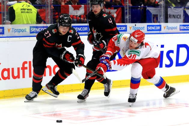 OSTRAVA, CZECH REPUBLIC - JANUARY 5, 2020: Canada s Barrett Hayton, Bowen Byram, and Russia s Dmitry Voronkov (L-R) in the 2020 World Junior Ice hockey, Eishockey Championship final match between Canada and Russia at Ostravar Arena. Peter Kovalev TASS  TS0C97E5