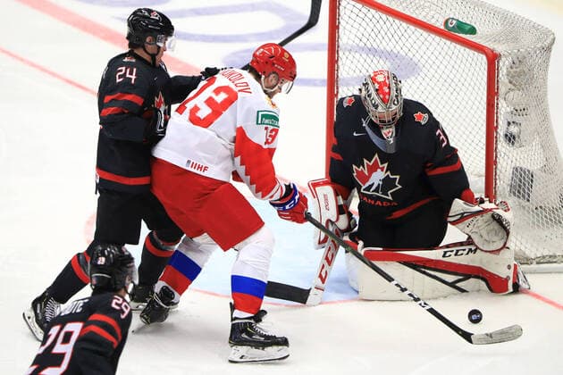 OSTRAVA, CZECH REPUBLIC - JANUARY 5, 2020: Canada s Nolan Foote (L front), Ty Smith (L back), goaltender Joel Hofer (R), and Russia s Yegor Sokolov (C) in the 2020 World Junior Ice hockey, Eishockey Championship final match between Canada and Russia at Ostravar Arena. Peter Kovalev TASS  TS0C97FD
