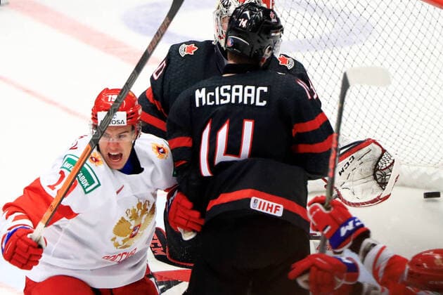 OSTRAVA, CZECH REPUBLIC - JANUARY 5, 2020: Russia s Nikita Rtishchev (L) scores a goal past Canada s Jared McIsaac (C front) and goaltender Joel Hofer (C back) in the 2020 World Junior Ice hockey, Eishockey Championship final match between Canada and Russia at Ostravar Arena. Peter Kovalev TASS  TS0C9802