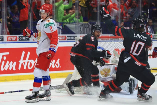 OSTRAVA, CZECH REPUBLIC - JANUARY 5, 2020: Canada s Akil Thomas (C) and Raphael Lavoie (R) celebrate a goal in the 2020 World Junior Ice hockey, Eishockey Championship final match between Canada and Russia at Ostravar Arena; left: Danil Zhuravlev. Peter Kovalev TASS  TS0C9808