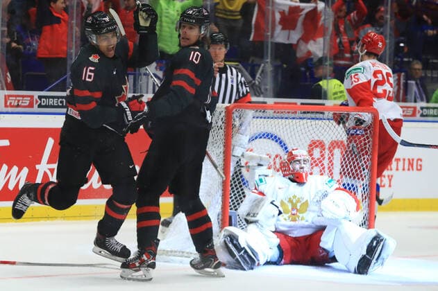 OSTRAVA, CZECH REPUBLIC - JANUARY 5, 2020: Canada s Akil Thomas (L) and Raphael Lavoie (2nd L) celebrate a goal past Russia s goaltender Amir Miftakhov (R sitting) in the 2020 World Junior Ice hockey, Eishockey Championship final match between Canada and Russia at Ostravar Arena; Canada won 4-3. Peter Kovalev TASS  TS0C980B