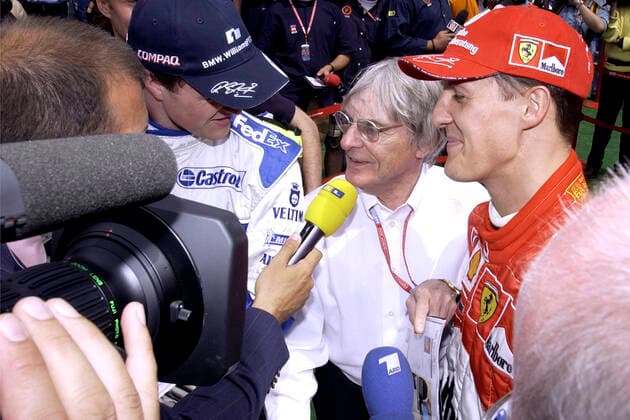 SCHUMACHER Michael F1 Team Scuderia Ferrari with brother SCHUMACHER Ralf , ECCLESTONE Bernie and EBEL Kai RTL GP of Spain 2002 in Barcelona on 27 04 2002 in Barcelona