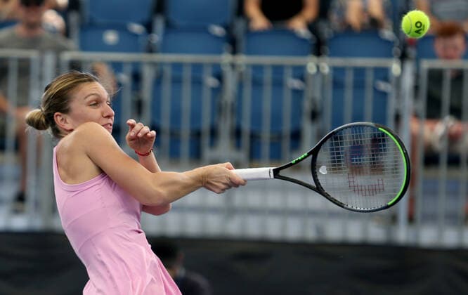 ADELAIDE INTERNATIONAL DAY 1, Simona Halep of Romania plays a shot against Angelique Kerber of Germany and Robert Farah of Columbia during the Adelaide International Rally for Resilience exhibition game on day 1 of the Adelaide International tennis tournament atMemorial Drive Tennis Centre inAdelaide, Sunday, January 12, 2020. ( NO ARCHIVING, EDITORIAL USE ONLY, NO USE IN BOOKS WITHOUT CONSENT ADELAIDE SA AUSTRALIA  Copyright: xKELLYxBARNESx 20200112001441698216