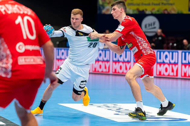 Handball, Men EM 2020, Main Round, Group 1, Belarus Germany violet in duel Philipp Weber Germany SC DHfK Leipzig and Viachaslau Bokhan Belarus Vienna Stadthalle Vienna Austria