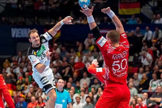 Handball, Men EM 2020, Main Round, Group 1, Belarus Germany from left Kai Häfner Haefner Germany MT Melsungen , Artsem Karalek Belarus Vienna Stadthalle Vienna Austria