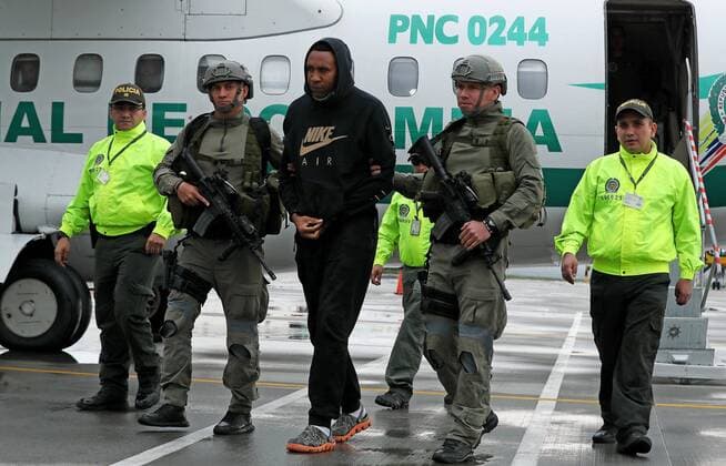 Former Colombian soccer player Jhon Viafara (C) walks scorted by members of Colombian Police upon his arrival to Catam military airport in Bogota, Colombia, 20 March 2019. Viafara was arrested and request for extradition by the United States for drug trafficking. Former Colombian soccer player arrested for drug trafficking !ACHTUNG: NUR REDAKTIONELLE NUTZUNG!  Copyright: xMAURICIOxDUEÑASxCASTAÑEDAx AME9382 20190320-636887181748078485 Former Colombian soccer player Jhon Viafara C walks scorted by members of Colombian Police upon hi !ACHTUNG: NUR REDAKTIONELLE NUTZUNG!  Copyright: xMAURICIOxDUEÑASxCASTAÑEDAx imago 90259691 90259691st