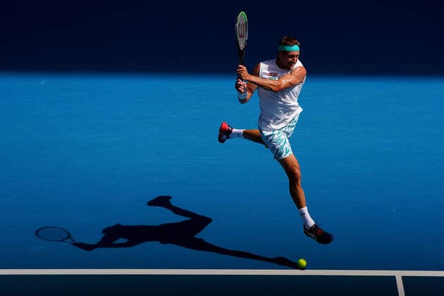 AUSTRALIAN OPEN DAY 9, Tennys Sandgren of the USA plays a return shot during his fifth round match against Roger Federer of Switzerland on day nine of the Australian Open tennis tournament at Rod Laver Arena in Melbourne, Tuesday, January 28, 2020. ( NO ARCHIVING, EDITORIAL USE ONLY, NO USE IN BOOKS WITHOUT CONSENT MELBOURNE VIC AUSTRALIA  Copyright: xSCOTTxBARBOURx 20200128001445150327