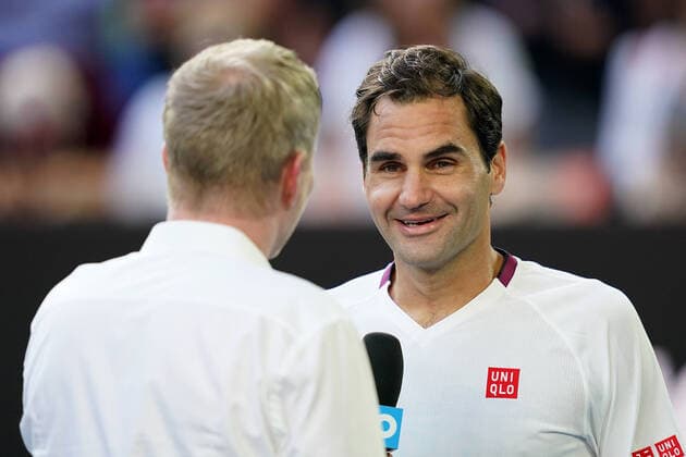 AUSTRALIAN OPEN DAY 9, Roger Federer of Switzerland speaks to Jim Courier after wining his fifth round match against Tennys Sandgren of the USA on day nine of the Australian Open tennis tournament at Rod Laver Arena in Melbourne, Tuesday, January 28, 2020. ( NO ARCHIVING, EDITORIAL USE ONLY, NO USE IN BOOKS WITHOUT CONSENT MELBOURNE VIC AUSTRALIA  Copyright: xMICHAELxDODGEx 20200128001445168877