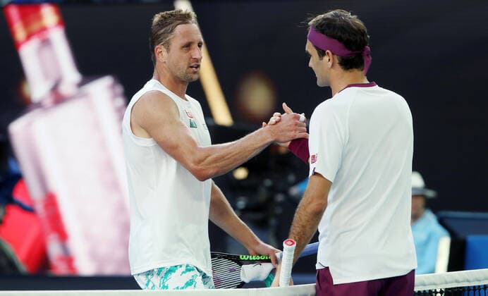 TENNIS - ATP, Tennis Herren Australian Open 2020 MELBOURNE,AUSTRALIA,28.JAN.20 - TENNIS - ATP World Tour, Grand Slam, Australian Open Image shows Tennys Sandgren (USA) and Roger Federer (SUI). GEPAxpictures xMatthiasxHauer