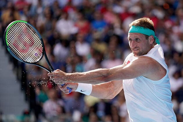 AUSTRALIAN OPEN DAY 9, Tennys Sandgren of the USA plays a return shot during his fifth round match against Roger Federer of Switzerland on day nine of the Australian Open tennis tournament at Rod Laver Arena in Melbourne, Tuesday, January 28, 2020. ( NO ARCHIVING, EDITORIAL USE ONLY, NO USE IN BOOKS WITHOUT CONSENT MELBOURNE VIC AUSTRALIA  Copyright: xMICHAELxDODGEx 20200128001445169520