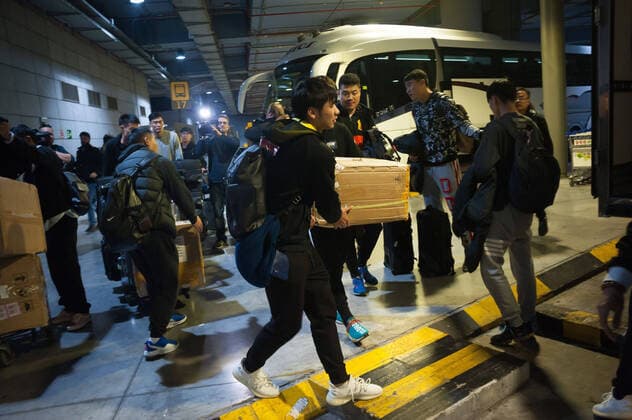 January 29, 2020, Malaga, Spain: Players prepare their bags at Malaga Costa del Sol airport..Wuhan Zall FC Chinese soccer team arrives at Malaga Costa del Sol airport for a pre-season training in Cadiz province. According to the Andalusia and Spanish government, the players are not infected with the Corona virus and during their stay, they will be subjected to health controls. The team will be in Andalusia until 15 February. Wuhan Zall FC team players in Malaga, Spain - 29 Jan 2020 - ZUMAs197 96526604st Copyright: xJesusxMeridax