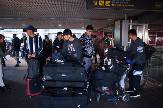 January 29, 2020, Malaga, Spain: Players with bags at Malaga Costa del Sol airport..Wuhan Zall FC Chinese soccer team arrives at Malaga Costa del Sol airport for a pre-season training in Cadiz province. According to the Andalusia and Spanish government, the players are not infected with the Corona virus and during their stay, they will be subjected to health controls. The team will be in Andalusia until 15 February. Wuhan Zall FC team players in Malaga, Spain - 29 Jan 2020 - ZUMAs197 96526644st Copyright: xJesusxMeridax