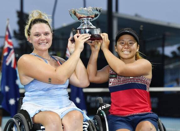 Tennis: Australian Open Jordanne Whiley (L) of the United Kingdom and Japan s Yui Kamiji celebrate their wheelchair doubles title at the Australian Open tennis tournament in Melbourne on Jan. 31, 2020. 