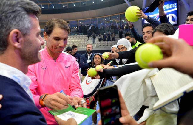 (200206) -- KUWAIT, Feb. 6, 2020 -- Rafael Nadal (C) signs autographs for fans after an exhibition match between Rafael Nadal and David Ferrer at the opening ceremony of Rafa Nadal Academy in Hawalli Governorate, Kuwait, on Feb. 5, 2020. (Photo by Asad Xinhua) (SP)KUWAIT-HAWALLI GOVERNORATE-RAFA NADAL ACADEMY-OPENING NiexYunpeng 