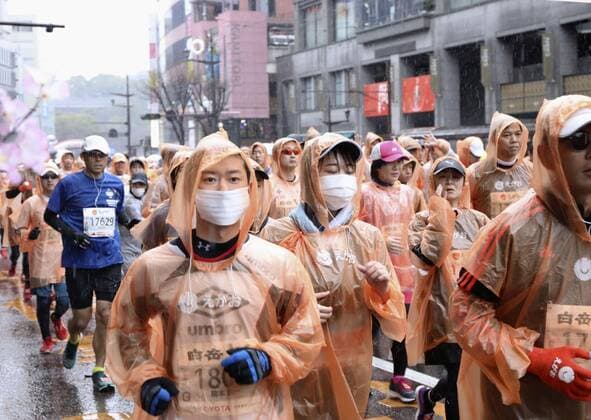 New coronavirus Runners wear masks during a marathon in Kumamoto, southwestern Japan, on Feb. 16, 2020, amid coronavirus fears. 