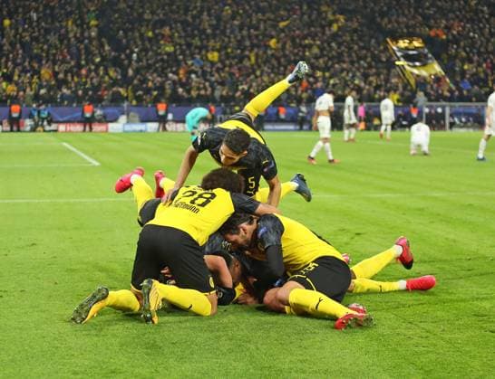 18 02 2020, Football UEFA Champions League 2019 2020, Round of 16, Borussia Dortmund Paris St Germain, at Signal Iduna Park Dortmund Torjubel Erling Haaland on the ground, Dortmund with Raphael Guerreiro Dortmund li Axel Witsel Dortmund re Mats Hummels Dortmund DFL and DFB regulations prohibit any use of photographs as image sequences and or quasi video