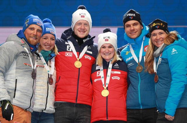 BIATHLON - IBU World Championships Antholz 2020 ANTHOLZ,ITALY,20.FEB.20 - BIATHLON - IBU World Championships 2020, single mixed relay. Image shows the rejoicing of Erik Lesser, Franziska Preuss (GER), Johannes Thingnes Boe, Marte Olsbu Roeiseland (NOR), Emilien Jacquelin and Anais Bescond (FRA). Keywords: medal. GEPAxpictures xAndreasxPranter