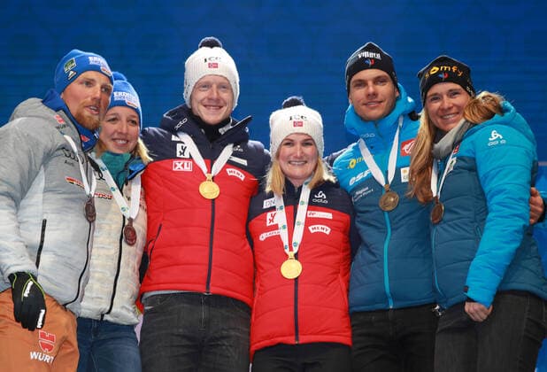 BIATHLON - IBU World Championships Antholz 2020 ANTHOLZ,ITALY,20.FEB.20 - BIATHLON - IBU World Championships 2020, single mixed relay. Image shows the rejoicing of Erik Lesser, Franziska Preuss (GER), Johannes Thingnes Boe, Marte Olsbu Roeiseland (NOR), Emilien Jacquelin and Anais Bescond (FRA). Keywords: medal. GEPAxpictures xAndreasxPranter