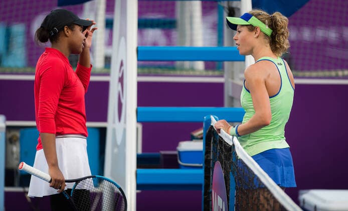 February 21, 2020, Dubai, UNITED ARAB EMIRATES: Laura Siegemund of Germany with Mubaraka Al-Naimi at the net after their qualifications match at the 2020 Qatar Total Open WTA, Tennis Damen Premier 5 tennis tournament 2020 Qatar Total Open, Tennis, Doha, Qatar, Feb 21 - ZUMAa181 20200221_zaa_a181_022 Copyright: xRobxPrangex