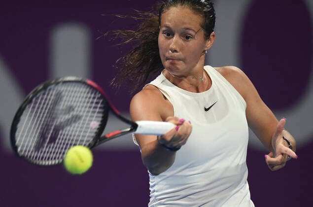 (200224) -- DOHA, Feb. 24, 2020 (Xinhua) -- Daria Kasatkina of Russia hits a return to Garbine Muguruza of Spain during their women s singels first round match at 2020 WTA, Tennis Damen Qatar Open tennis tournament in Doha, Qatar, Feb. 23, 2020. (Photo by Nikku Xinhua) (SP)QATAR-DOHA-TENNIS-WTA-SINGLES 