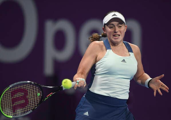(200224) -- DOHA, Feb. 24, 2020 (Xinhua) -- Jelena Ostapenko of Latvia hits a return to Jil Teichmann of Switzerland during their women s singels first round match at 2020 WTA, Tennis Damen Qatar Open tennis tournament in Doha, Qatar, Feb. 23, 2020. (Photo by Nikku Xinhua) (SP)QATAR-DOHA-TENNIS-WTA-SINGLES 