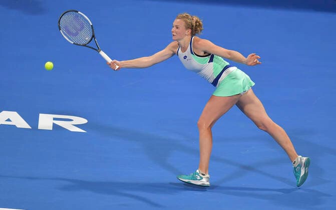 (200224) -- DOHA, Feb. 24, 2020 (Xinhua) -- Katerina Siniakova of the Czech Republic hits a return to Ons Jabeur of Tunisia during their women s singels first round match at 2020 WTA, Tennis Damen Qatar Open tennis tournament in Doha, Qatar, Feb. 23, 2020. (Photo by Nikku Xinhua) (SP)QATAR-DOHA-TENNIS-WTA-SINGLES 
