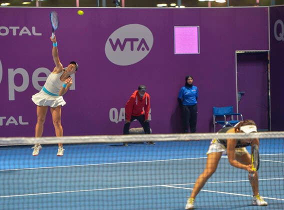 (200224) -- DOHA, Feb. 24, 2020 (Xinhua) -- Xu Yifan of China and her partner Nicole Melichar (L) of the United States compete during the women s doubles first round match against Alicja Rosolska of Poland and Alexa Guarachi Mathison of Chile at 2020 WTA, Tennis Damen Qatar Open tennis tournament in Doha, Qatar, Feb. 23, 2020. (Photo by Nikku Xinhua) (SP)QATAR-DOHA-TENNIS-WTA-DOUBLES 